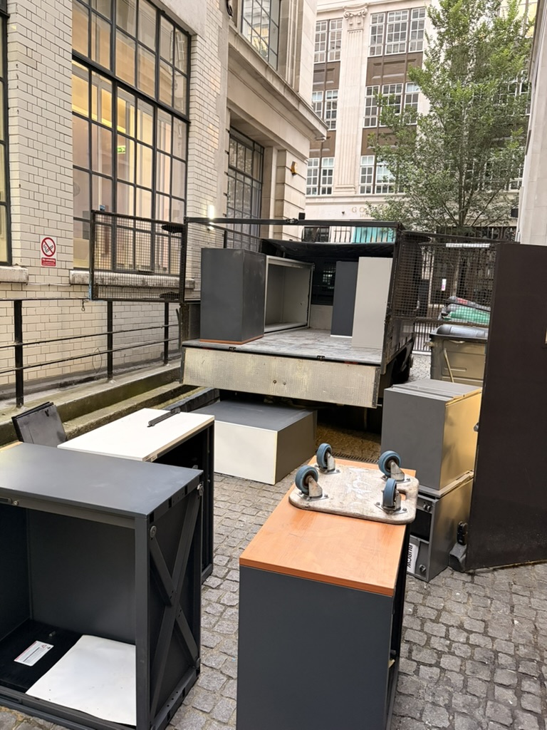 Office cabinets and pedestals beside a loading bay during an LCWC clearance in EC2R