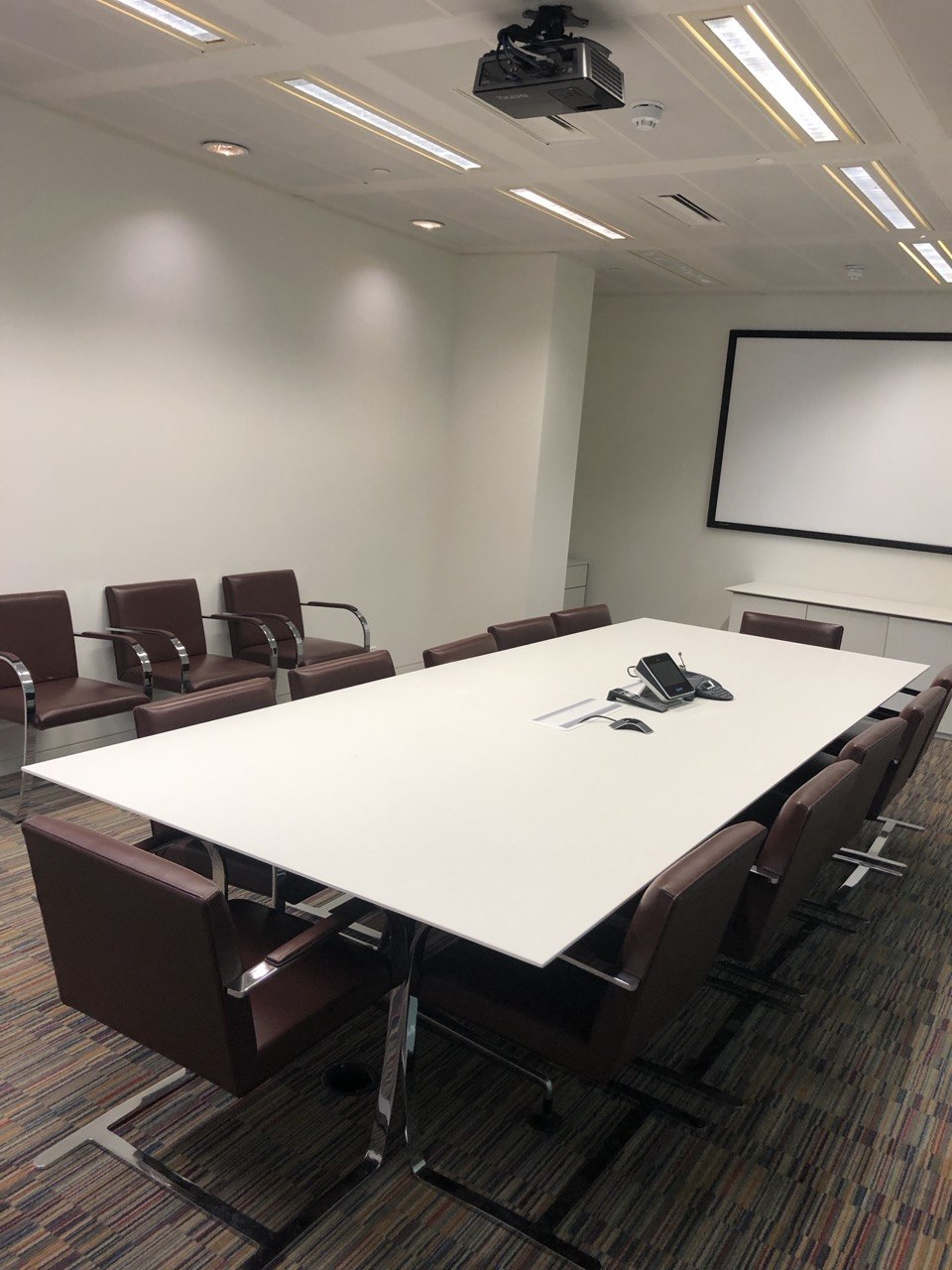 Tidy office meeting room prepared for end-of-lease clearance planning