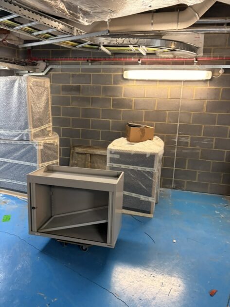 Metal office cupboard on a furniture skate during removal